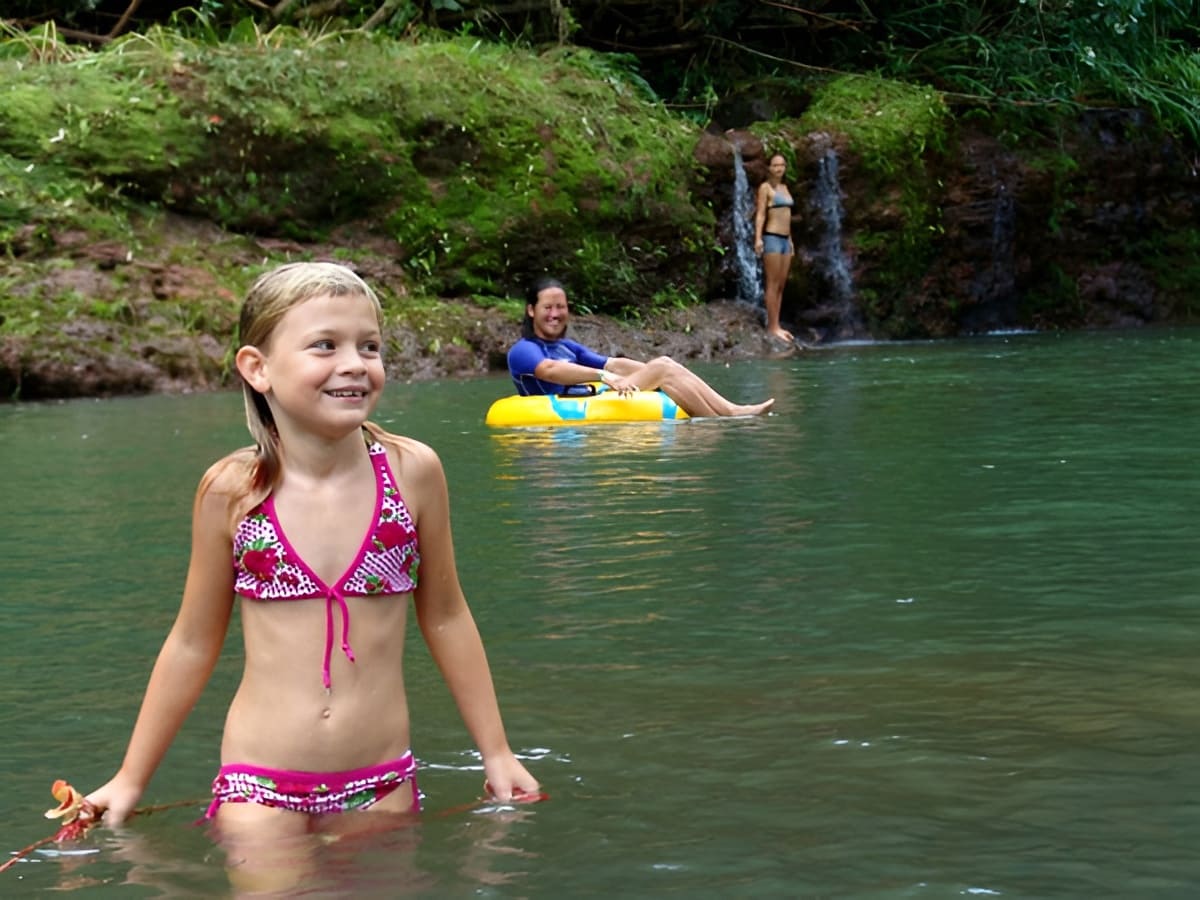Guests cooling off in a natural swimming hole